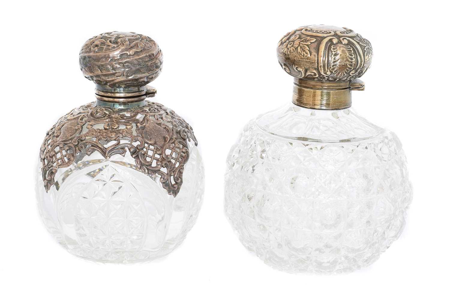 Lot 102 - Two silver mounted clear glass scent bottles