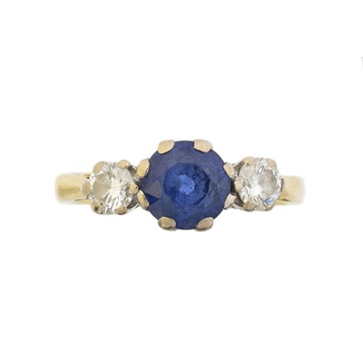 Lot 114 - An 18ct gold sapphire and diamond three stone ring by Boodles