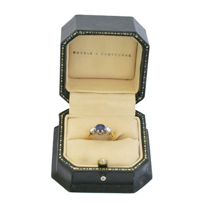 Lot 114 - An 18ct gold sapphire and diamond three stone ring by Boodles