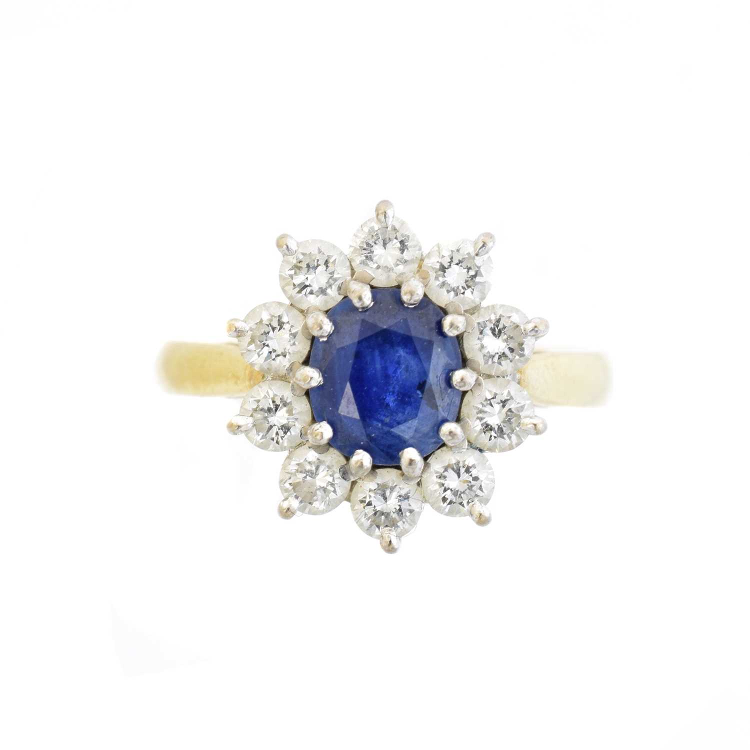 Lot 111 - An 18ct gold sapphire and diamond cluster ring