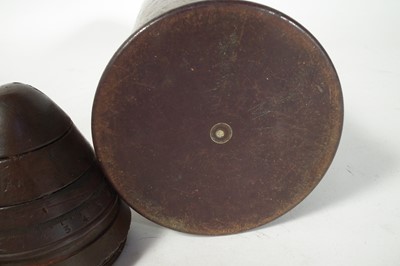 Lot 149 - Three WWI artillery fuses and a shell case