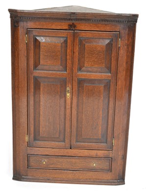 Lot 292 - Late 18th-century oak corner cupboard