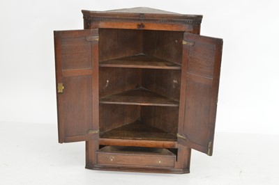 Lot 292 - Late 18th-century oak corner cupboard