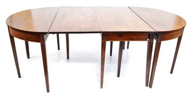 Lot 409 - George III mahogany dining table