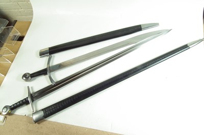 Lot 29 - Two modern replica swords and scabbards