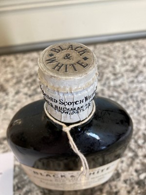 Lot 187 - 1 Half Flask Bottle Buchanan’s Black & White Whisky ‘Special Blend’ from early 1950’s