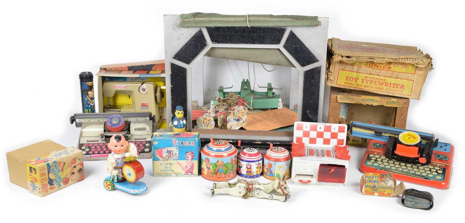 Lot 107 - Selection of items including instruments and theatre-related toys