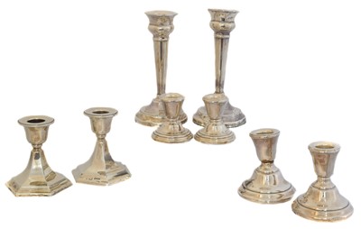 Lot 155 - Four pairs of George V and later silver candlesticks