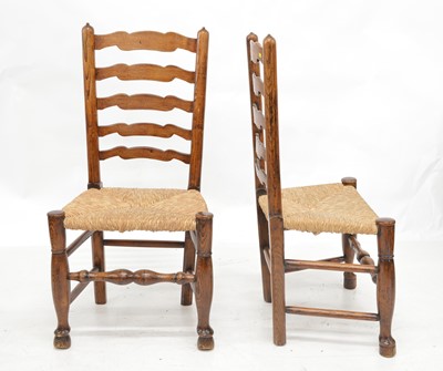 Lot 373 - A set of six Lancashire wavy ladder-back ash and elm single dining chairs