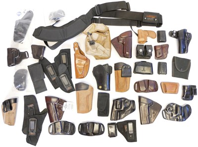 Lot 224 - Collection of pistol and revolver holsters speed loaders etc