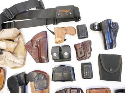 Lot 224 - Collection of pistol and revolver holsters speed loaders etc