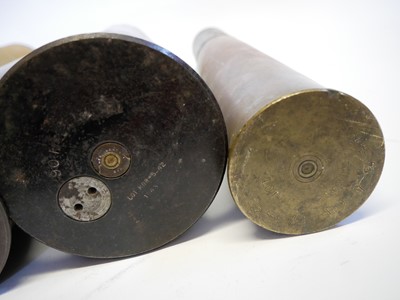Lot 142 - Four shell cases, one with head