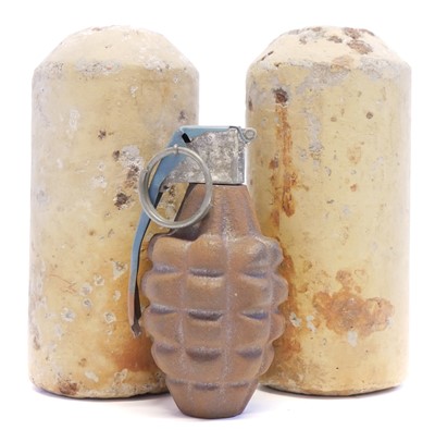 Lot 114 - WWII USA pineapple grenade and two German concrete mines or grenades