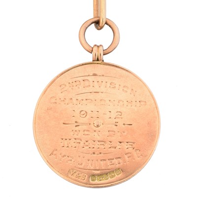 Lot 58 - An early 20th century 9ct gold enamel football medallion