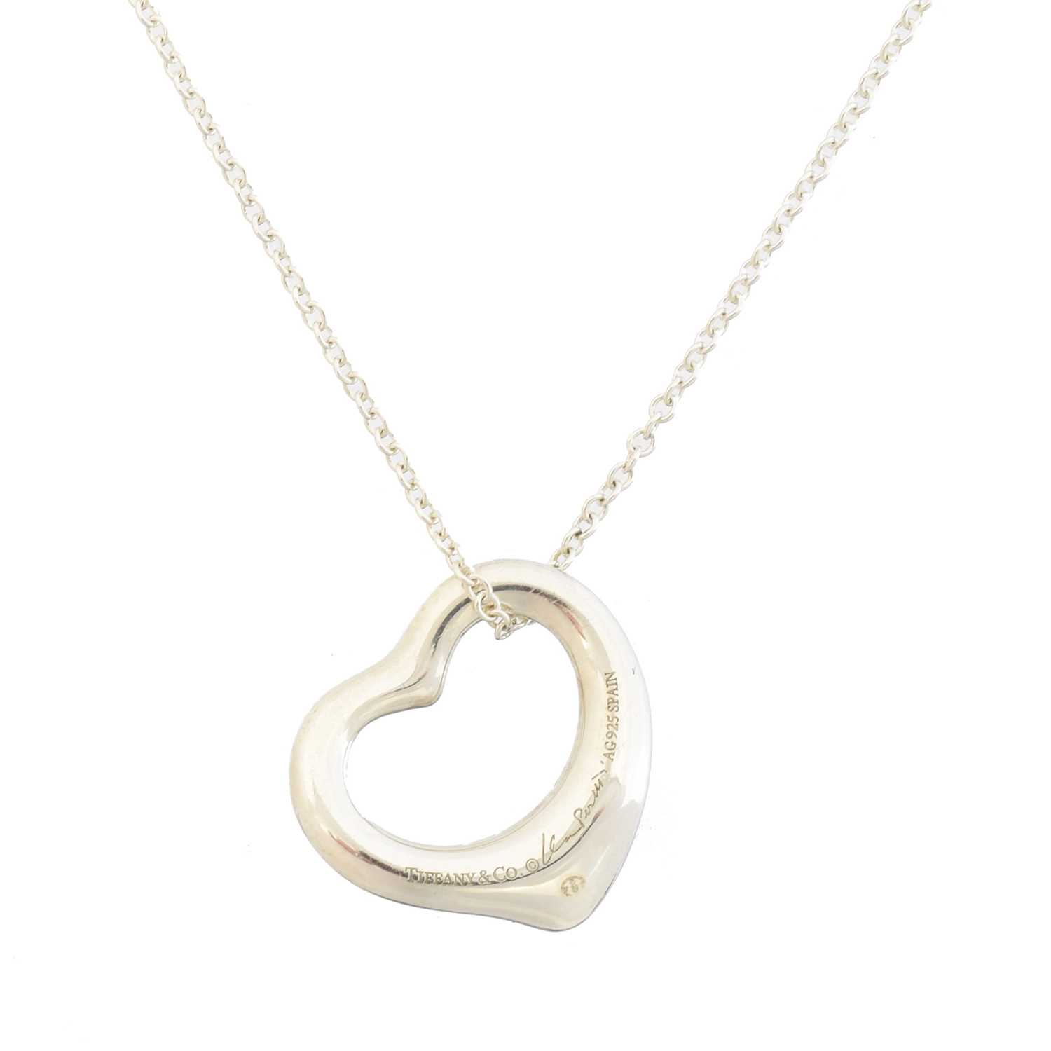 Lot 64 - A silver open heart pendant by Elsa Peretti for Tiffany & Co.