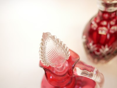 Lot 190 - A pair of flash ruby decanters and one other cranberry decanter.