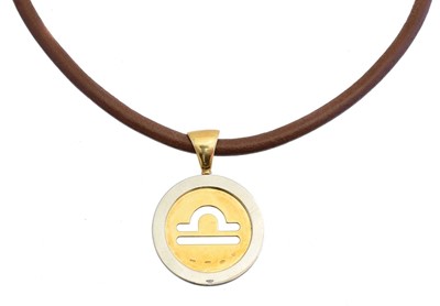 Lot 71 - An 18ct gold and stainless steel Zodiac Tondo necklace by Bulgari