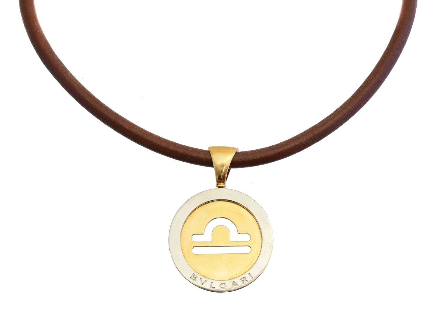 Lot 71 - An 18ct gold and stainless steel Zodiac Tondo necklace by Bulgari