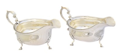 Lot 129 - A pair of George V silver sauce boats