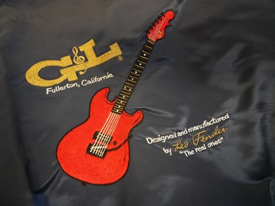 Lot 223 - G&L Fender jacket, Fender Service manual and a pencil drawing of Leo Fender