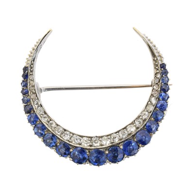 Lot 13 - A sapphire and diamond crescent brooch