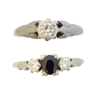 Lot 61 - Two gem-set dress rings