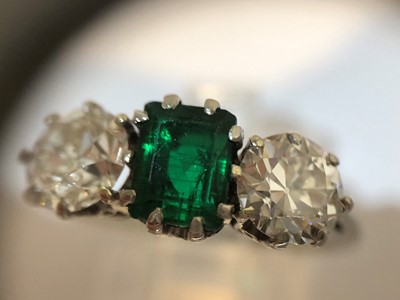 Lot 163 - An emerald and diamond three stone ring