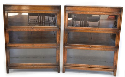 Lot 259 - A pair of three-tier oak stacking bookcases by Gumm