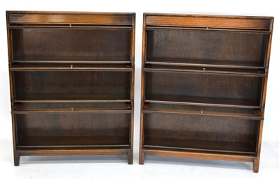 Lot 259 - A pair of three-tier oak stacking bookcases by Gumm