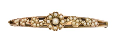 Lot 15 - An early 20th century split pearl hinged bangle