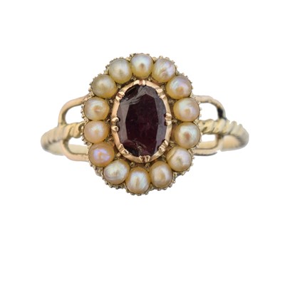 Lot 128 - A 19th century garnet and split pearl cluster ring