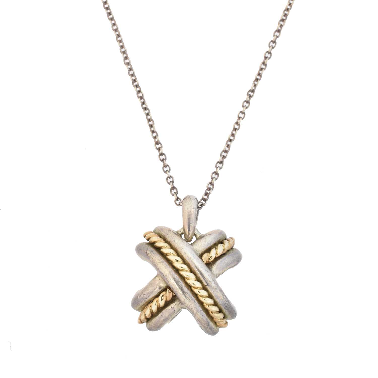 Lot 48 - A Tiffany & Co. silver and gold cross pendant