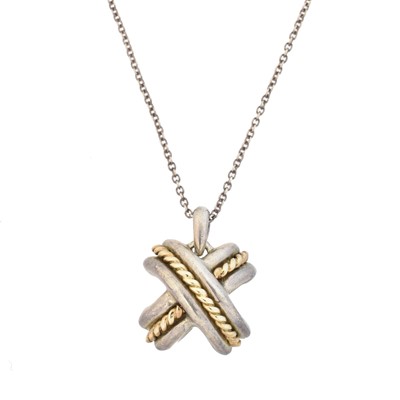 Lot 48 - A Tiffany & Co. silver and gold cross pendant