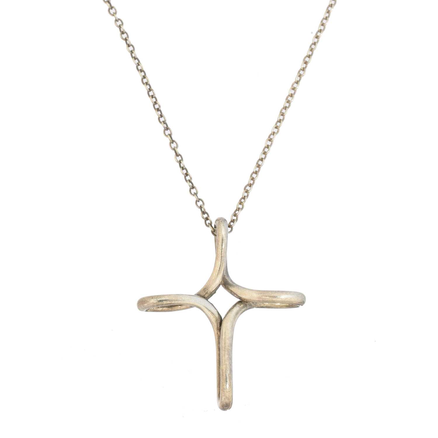 Lot 47 - An 'Infinity Cross' pendant by Elsa Peretti for Tiffany & Co.