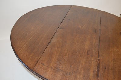 Lot 302 - George II mahogany drop-leaf dining table