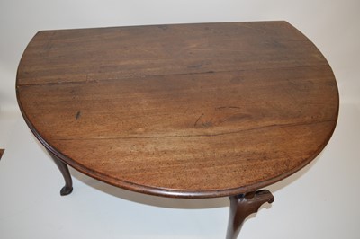 Lot 302 - George II mahogany drop-leaf dining table