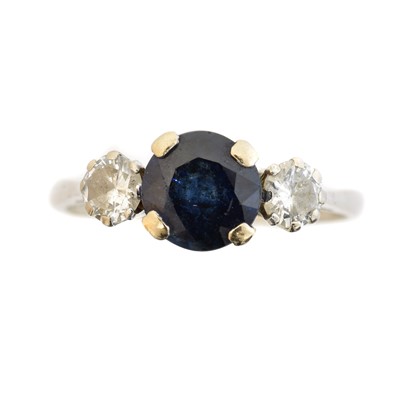 Lot 105 - An 18ct gold sapphire and diamond three stone ring