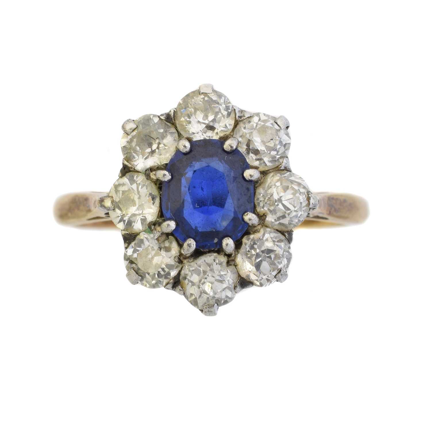Lot 103 - An 18ct gold sapphire and diamond cluster ring
