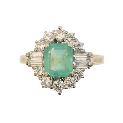 Lot 145 - An 18ct gold emerald and diamond cluster ring