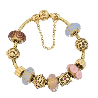 Lot 12 - A 14ct gold Pandora charm bracelet