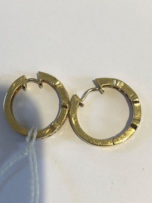 Lot 33 - A pair of 18ct gold diamond hoop earrings
