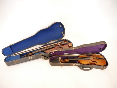 Lot 225 - 4/4 violin and a 1/2 size violin, each with a bow and case.