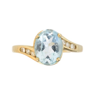 Lot 56 - A 9ct gold blue topaz and diamond dress ring