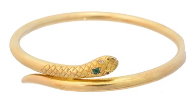 Lot 14 - An early 20th century gold emerald and diamond snake bangle