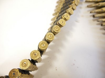 Lot 189 - Two metres of fired GPMG 7.62 blanks on belt clips.