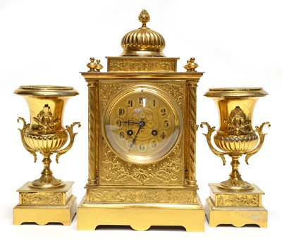Lot 213 - Victorian gilded clock garniture, with key and pendulum