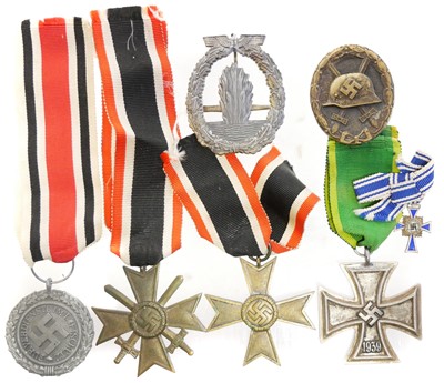 Lot 406 - Seven German WWII medals / badges.
