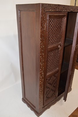 Lot 250 - Early 20th-century Indian brown painted heavily carved food cupboard