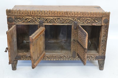 Lot 257 - Early 20th century Indian chipped carved side cupboard