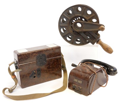 Lot 384 - German WWII Field Bakelite telephone, field telephone, and a hand held cable reel